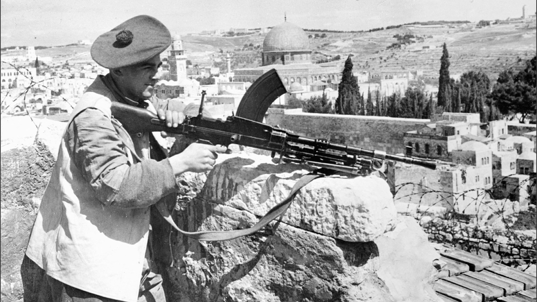 A British soldier holding a British-made Bren machine gun in Jerusalem on 1 May 1948, a fortnight before the British Mandate in Palestine ended (AFP)