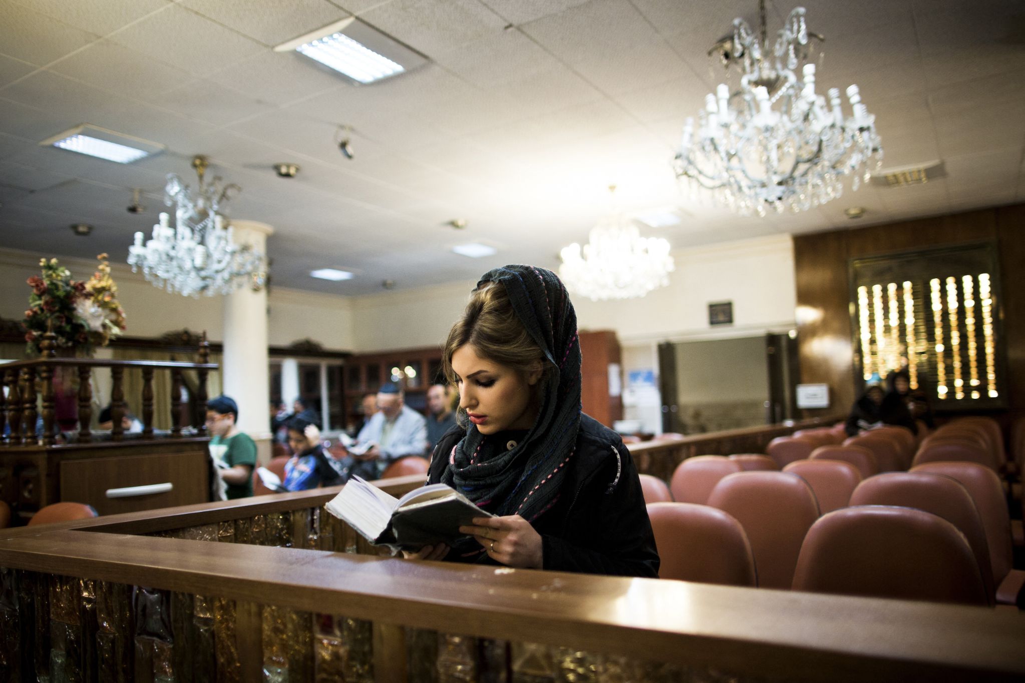 Special prayers are recited before lighting the menorah during the celebration (AFP/Behrouz Mehri)
