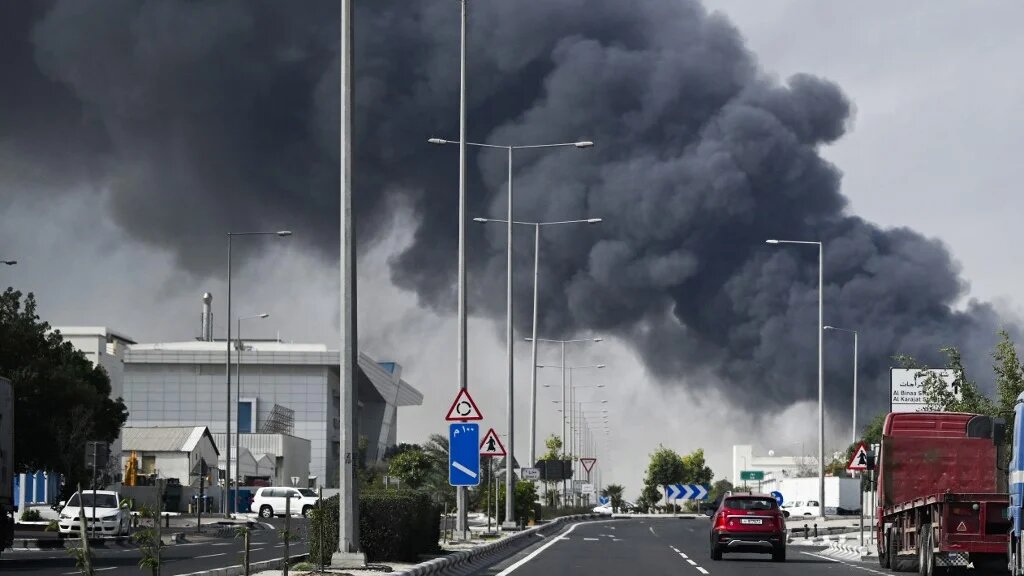 A plume of smoke rises from a reported Iranian strike in the industrial district of Doha, the capital of Qatar, on 1 March 2026 (Mahmud Hams/AFP)