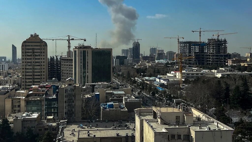 A plume of smoke rises following a reported explosion in Tehran on February 28, 2026 (AFP)