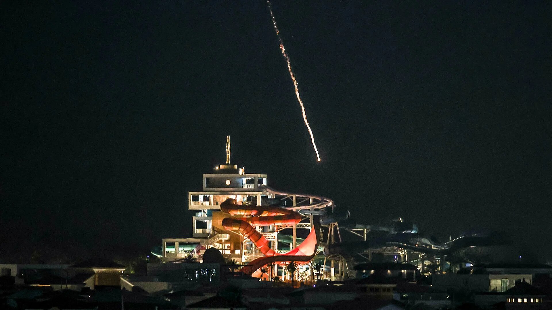 An intercepted projectile falls into the sea near Dubai's Palm Jumeirah archipelago on 1 March 2026 (AFP/Fadel Senna)