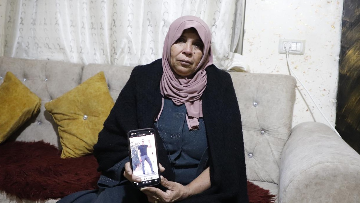Najah Abdul Qader, the mother of Ahmad Tazaza, at home in Qabatiya in the northern occupied West Bank in January 2026 (Muhammed Atiq/MEE)