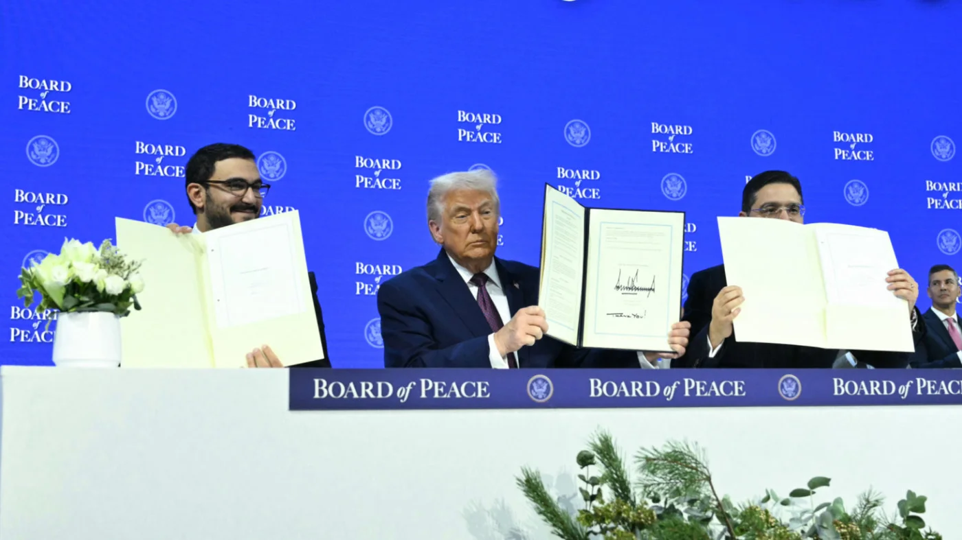 Bahrain's Minister of the Prime Minister's court Sheikh Isa bin Salman bin Hamad al-Khalifa, US President Donald Trump, Morocco's Foreign Minister Nasser Bourita at Davos on 22 January 2026 (AFP)