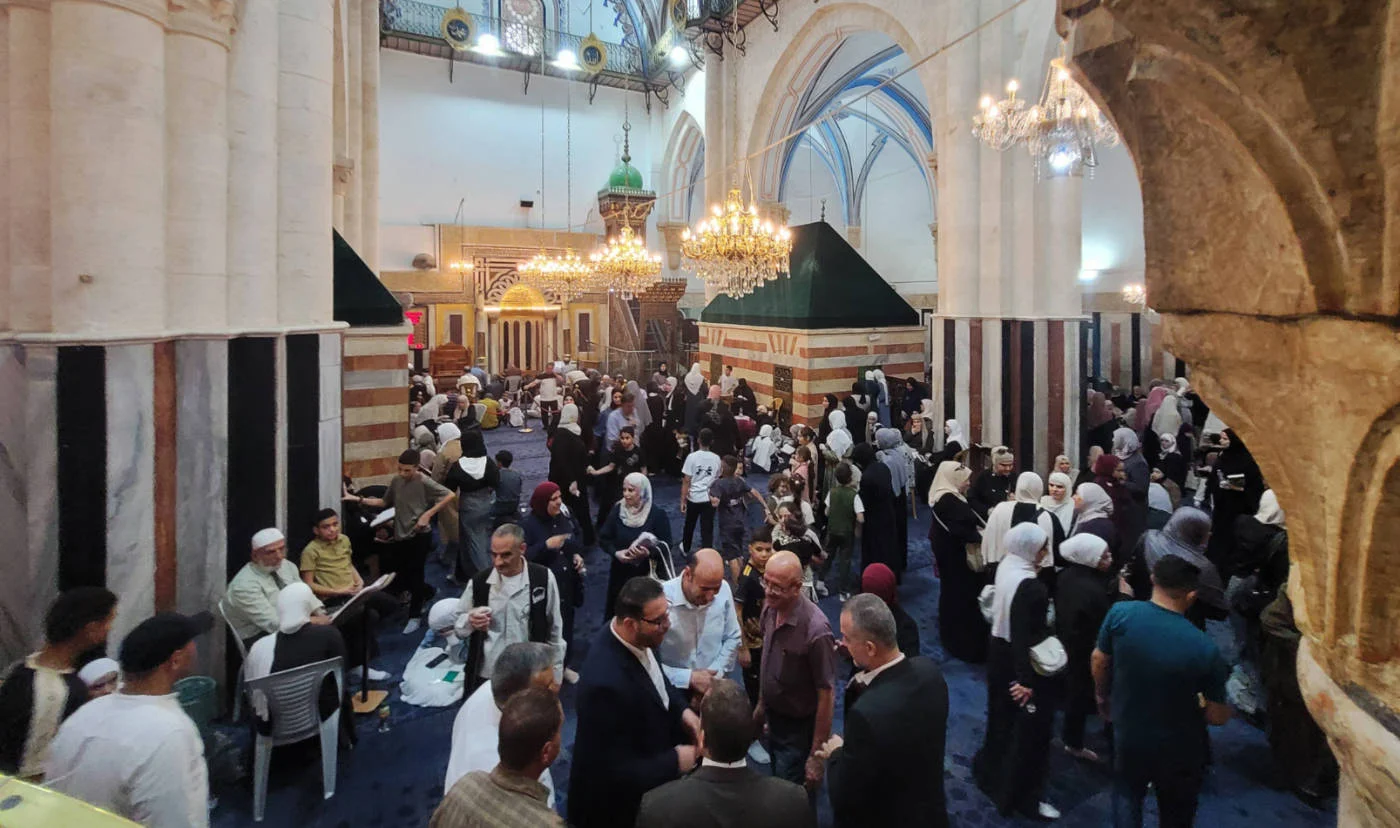 Palestinians gather at the Ibrahimi Mosque in Hebron on 4 September 2025 to mark the Prophet Muhammad’s birthday (Reuters)