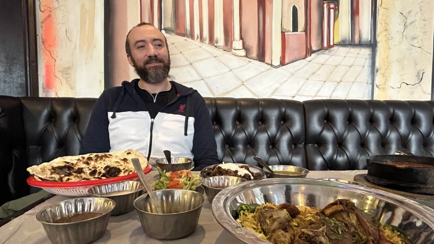 Mohammed Nagy, a lifelong Liverpool fan from Egypt, pictured at the Palm restaurant, 13 December 2025 (Oscar Rickett/MEE)