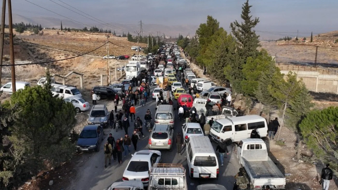 This aerial photo shows traffic as people gather at the Sednaya prison in Damascus on December 9, 2024 (Omar Haj Kadour/AFP)