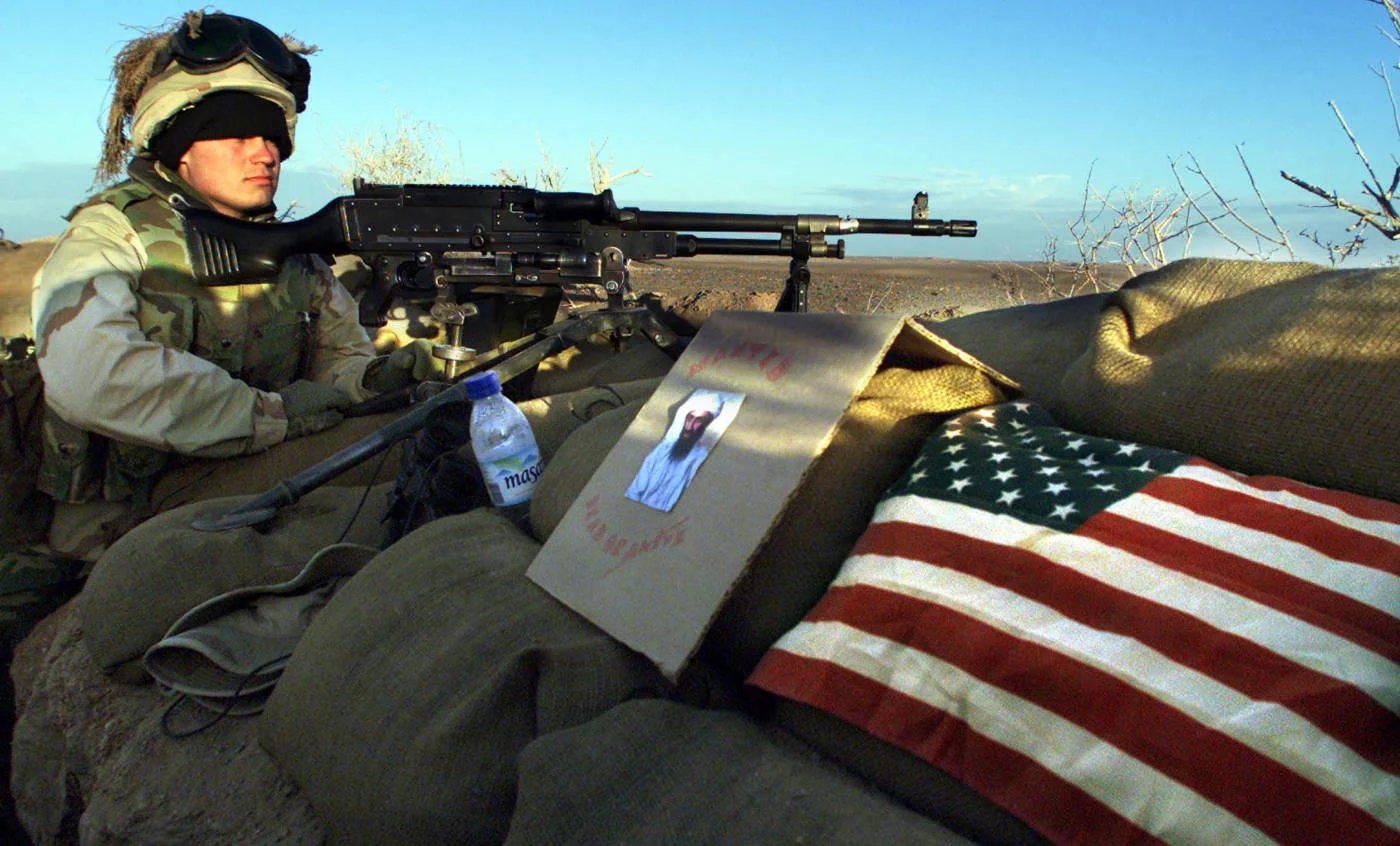 US Marine Brad Luschinski mans his position in southern Afghanistan in  December, 2001 (AFP)