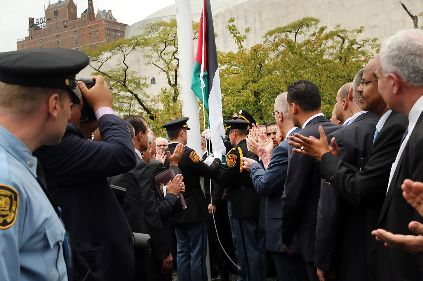 The Palestinian flag is raised for the first time at the UN in New York on 30  September 2015 (AFP)