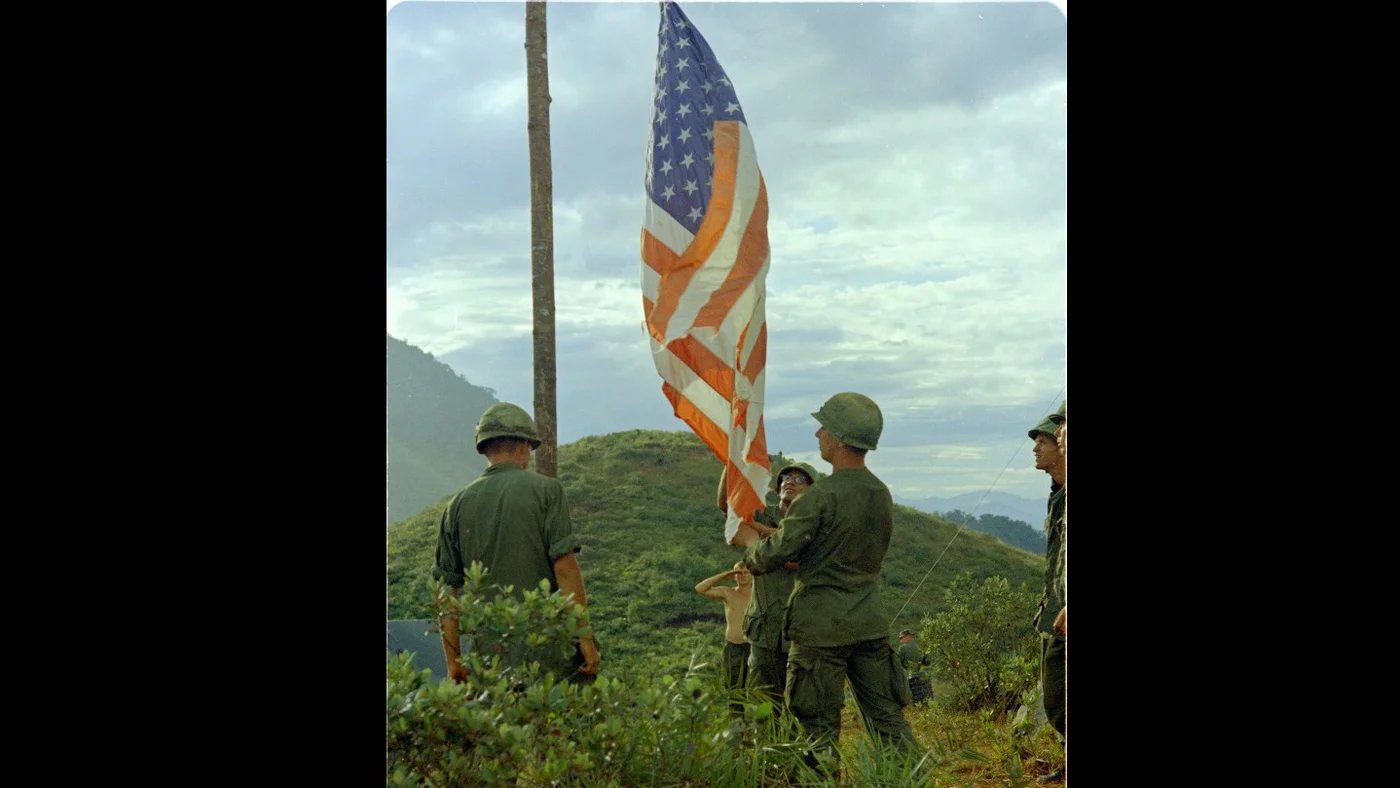 US soldiers raised the American flag on Ranger Hill while conducting search and destroy missions in the mountains of Quang Ngai Province, Vietnam, in September 1967 (US National Archives)